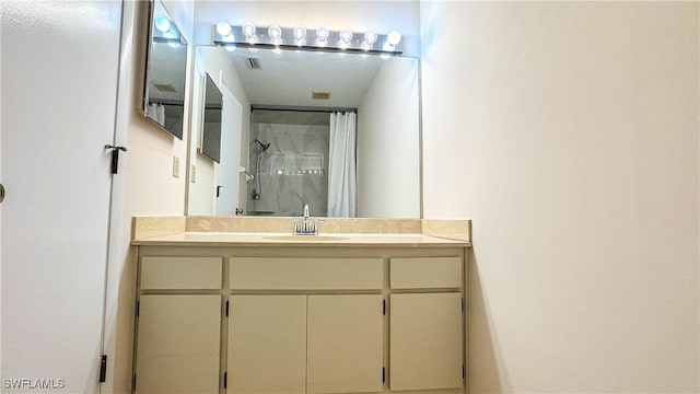 full bathroom with visible vents, a shower with curtain, and vanity