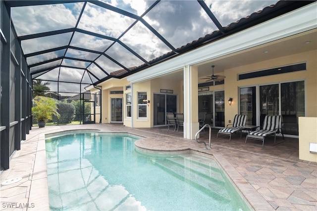 outdoor pool featuring a patio and ceiling fan