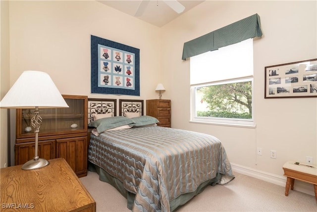 bedroom featuring baseboards and carpet