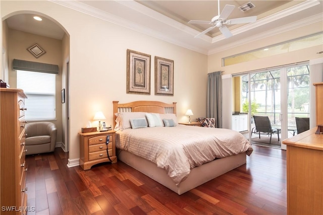 bedroom with arched walkways, crown molding, dark wood-type flooring, and access to outside