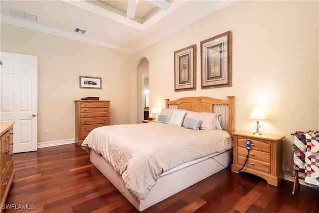 bedroom featuring crown molding, arched walkways, visible vents, and dark wood-style flooring