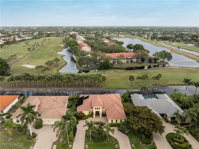 drone / aerial view featuring a water view and view of golf course