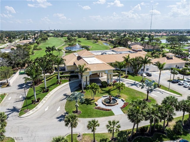 aerial view with golf course view and a residential view