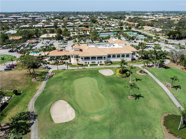 aerial view with golf course view and a residential view