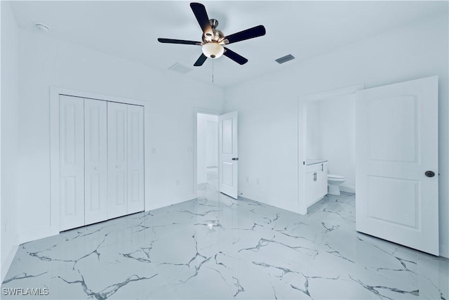 unfurnished bedroom featuring visible vents, connected bathroom, ceiling fan, a closet, and marble finish floor