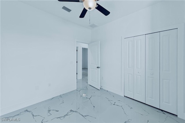 unfurnished bedroom with a ceiling fan, baseboards, visible vents, a closet, and marble finish floor