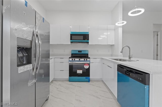 kitchen featuring marble finish floor, appliances with stainless steel finishes, modern cabinets, and a sink