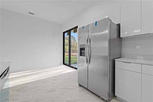 kitchen with white cabinets, modern cabinets, marble finish floor, and stainless steel appliances