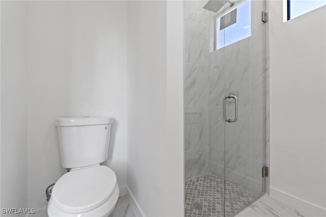 bathroom with baseboards, toilet, marble finish floor, and a shower stall