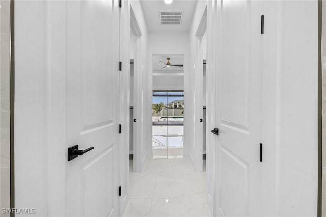 hall with visible vents and marble finish floor