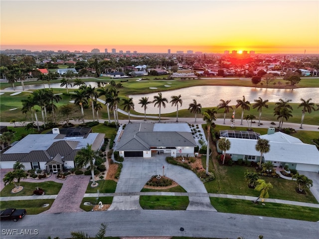 aerial view with view of golf course and a water view