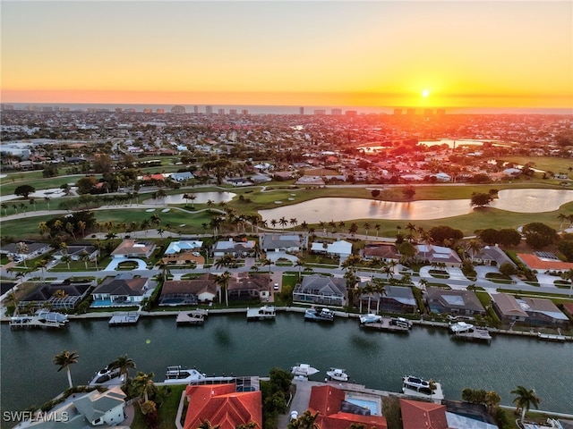 drone / aerial view featuring a residential view and a water view