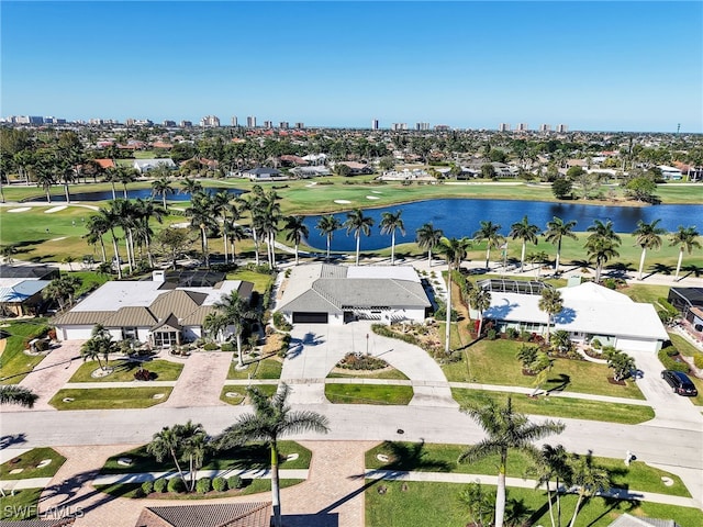 bird's eye view featuring a water view and view of golf course