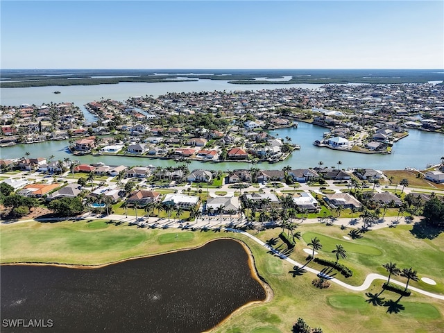 bird's eye view with view of golf course and a water view