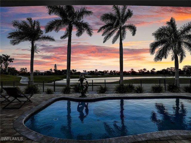 view of swimming pool with a fenced in pool and fence