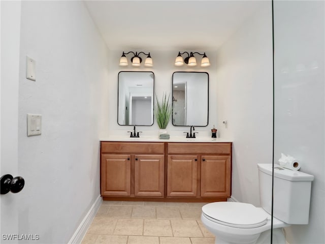 full bath with double vanity, toilet, baseboards, and a sink