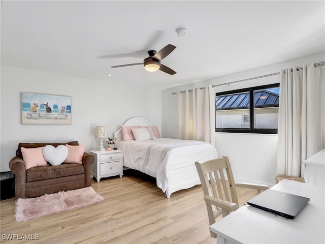 bedroom featuring light wood-style floors and ceiling fan