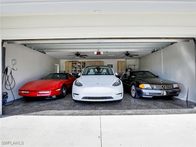 garage featuring a ceiling fan and a garage door opener