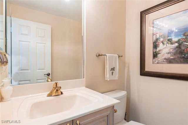 bathroom with vanity and toilet