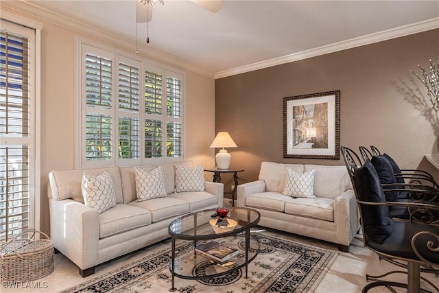 living area featuring ceiling fan and crown molding