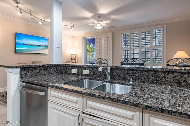 kitchen with stainless steel dishwasher, crown molding, a ceiling fan, and a sink