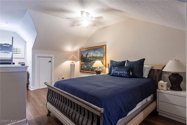 bedroom with a textured ceiling, wood finished floors, a ceiling fan, and vaulted ceiling