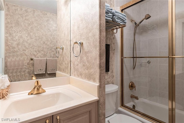 full bathroom featuring vanity, toilet, and enclosed tub / shower combo