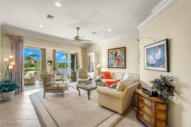 living area featuring crown molding, light tile patterned flooring, and recessed lighting