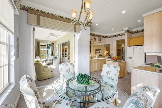 dining area featuring crown molding, baseboards, light tile patterned floors, recessed lighting, and ceiling fan with notable chandelier