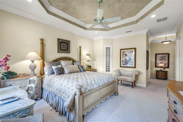 bedroom featuring baseboards, visible vents, ornamental molding, light carpet, and a raised ceiling