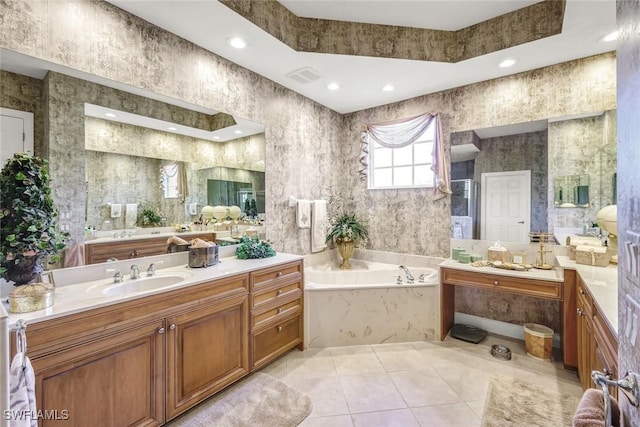 bathroom with vanity, recessed lighting, a garden tub, tile patterned floors, and a raised ceiling