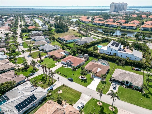 aerial view with a residential view and a water view