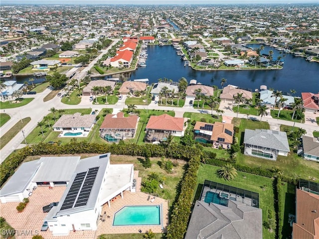 birds eye view of property featuring a residential view and a water view