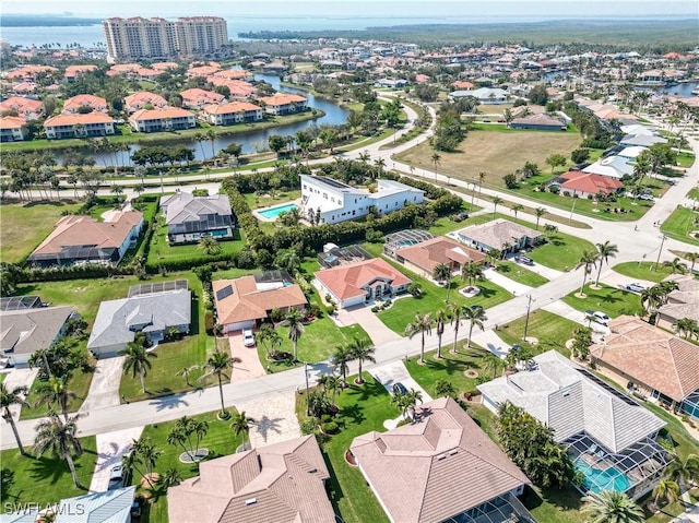 birds eye view of property featuring a residential view and a water view