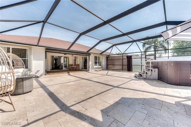 view of patio featuring a lanai and central air condition unit