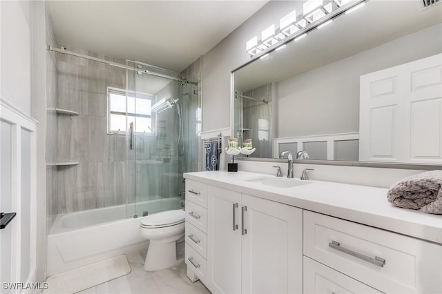 full bath with visible vents, enclosed tub / shower combo, toilet, and vanity