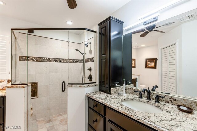 full bathroom with visible vents, ceiling fan, recessed lighting, a stall shower, and vanity