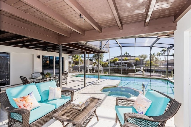 exterior space with a patio area, an outdoor living space, glass enclosure, and an in ground hot tub