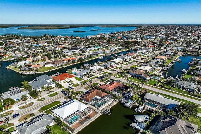 aerial view with a water view and a residential view