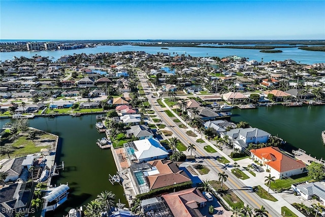 aerial view with a water view and a residential view