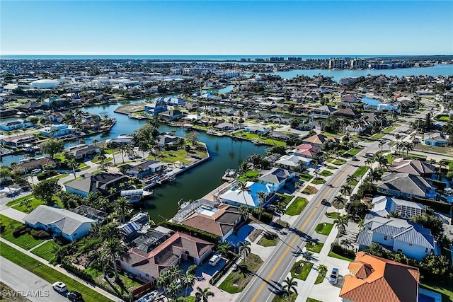 aerial view with a residential view and a water view