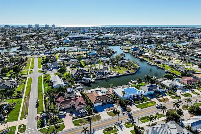 birds eye view of property featuring a residential view and a water view