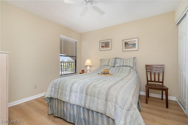 bedroom with light wood-type flooring, baseboards, and ceiling fan