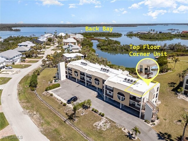 birds eye view of property featuring a water view