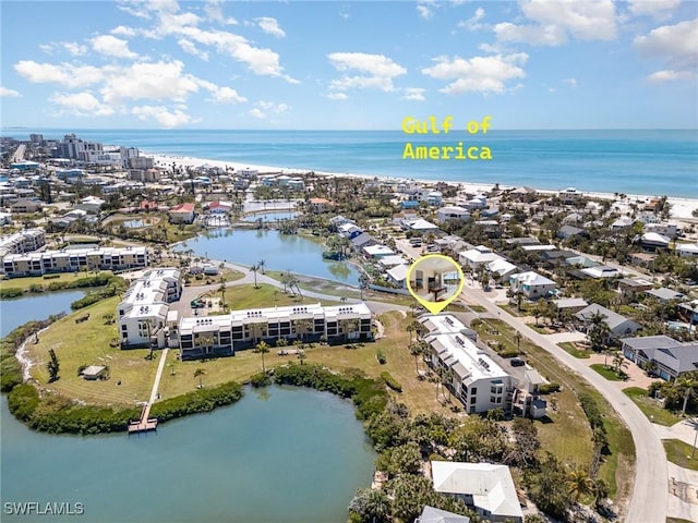birds eye view of property featuring a water view