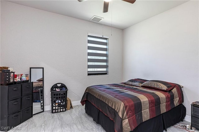 bedroom with visible vents, baseboards, marble finish floor, and a ceiling fan