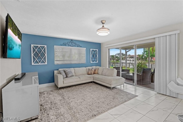 living room featuring marble finish floor