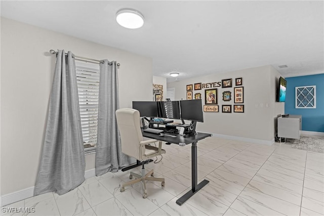 office featuring baseboards and marble finish floor