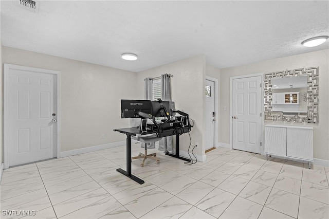 office area with baseboards, visible vents, and marble finish floor