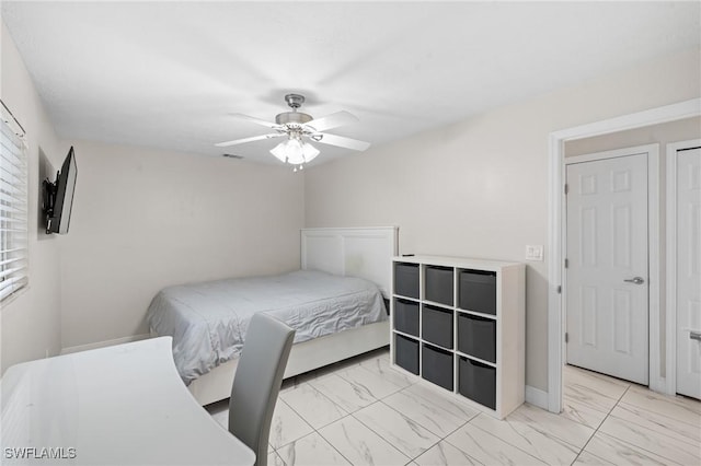 bedroom with visible vents, marble finish floor, baseboards, and a ceiling fan